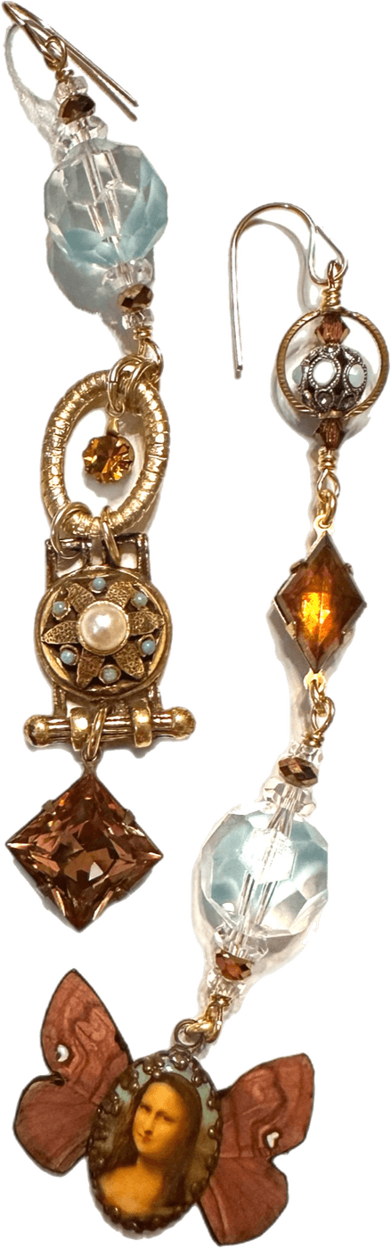 A pair of one-of-a-kind mixed-media drop earrings in brass and crystal, finished with a hand-set cameo.